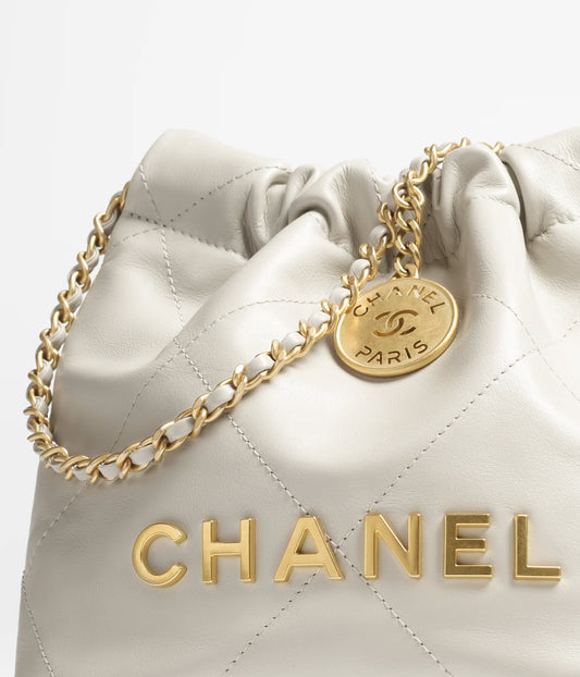 Chanel 22 Mini Handbag Shiny Calfskin & Gold-Tone Metal - Light Grey